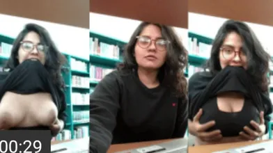 Vintage viral busty Desi girl in library pulls shirt up to
