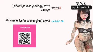 Tattooed female taunting in pair of shorts