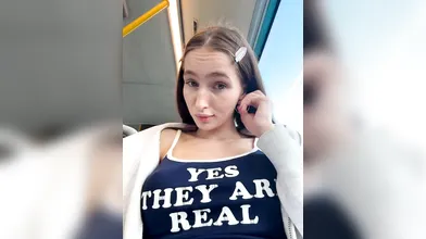 Brunette Woman Shows Natural Assets in Train Car - Yes They Are Real