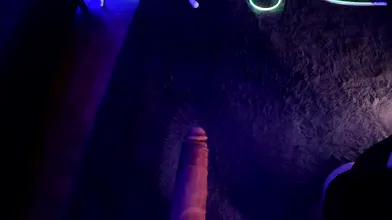 Goth Brunette Gives Sloppy Blowjob Under Purple Lights