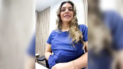 Blonde Nurse in Blue Scrubs Teases and Strips in Doctor's Office