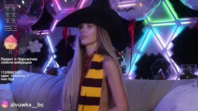 Sexy Blonde in Witch Hat at Neon Party - Cosplay Halloween Vibes