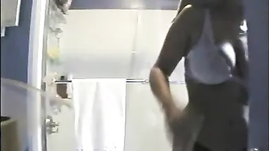 Peeping on naked busty roommate in the shower