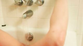 Shy girl next door masturbating in bathtub