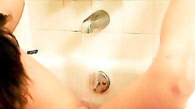 Shy girl next door masturbating in bathtub
