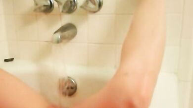 Shy girl next door masturbating in bathtub
