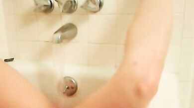 Shy girl next door masturbating in bathtub