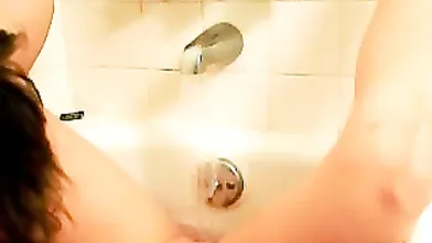 Shy girl next door masturbating in bathtub