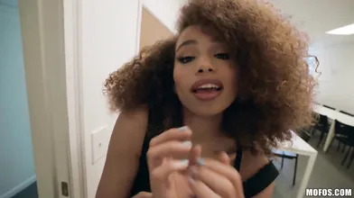Curly haired black beauty slobbers a big cock