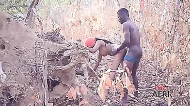 African babe is moaning while getting fucked in the nature, because it feels so good