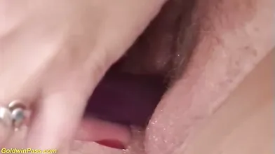 Insatiable granny is stimulating her soaking wet pussy and moaning while getting fucked