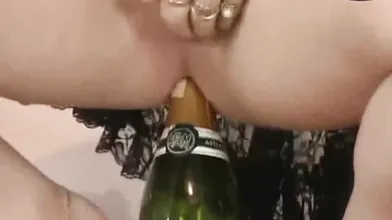 not too old German Trans woman with a bottle in the ass and a femdom woman