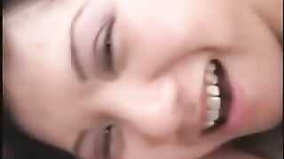 Chinese cutie watches straight into the camera while her boyfriend takes her from behind