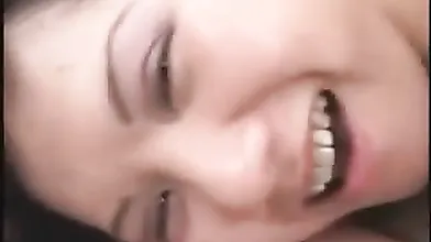 Chinese cutie watches straight into the camera while her boyfriend takes her from behind