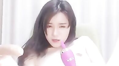 Chinese brunette is often masturbating on cam just because it feels so fucking good, every time