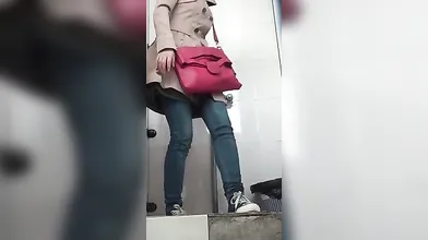 Chinese girls are peeing in a public toilet in front of a hidden camera, all day long